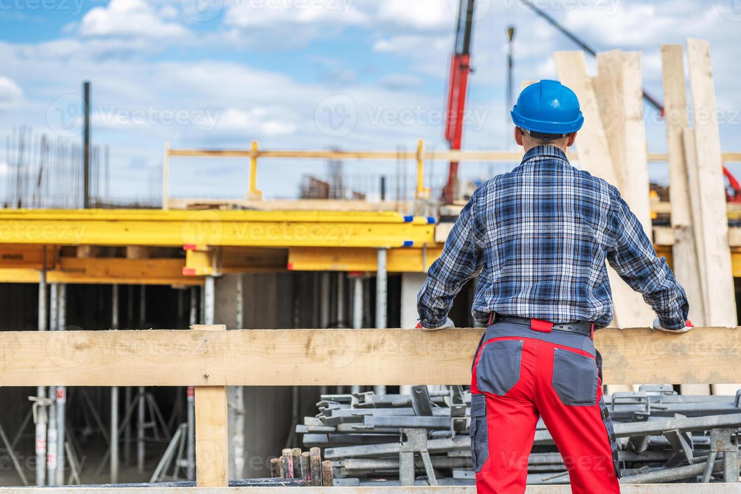 Construction Worker Overseeing Site Progress at Daylight photo