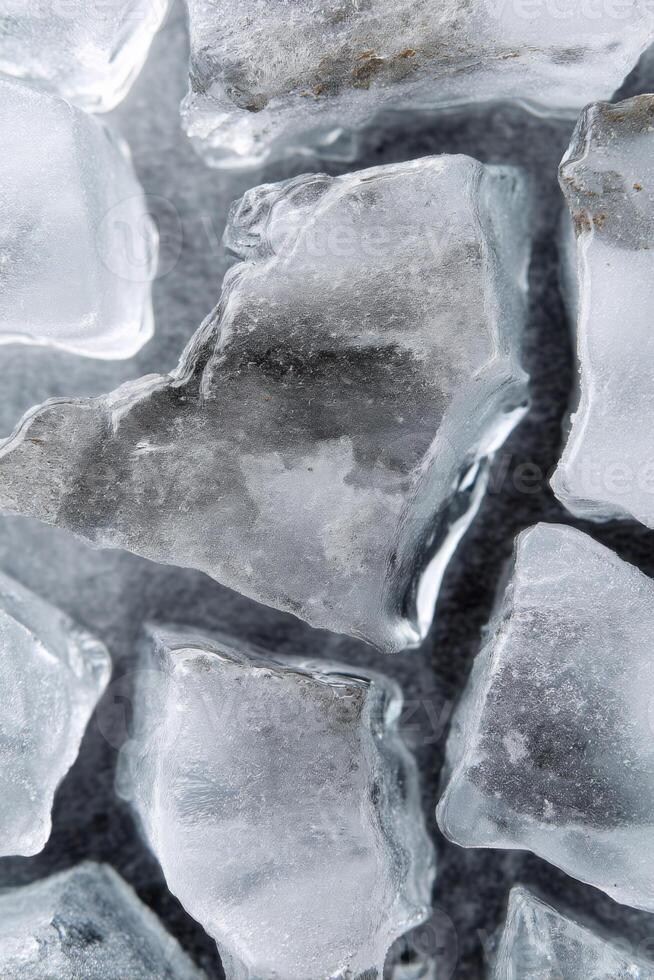 Close-up of melting textured cracked ice cubes forming abstract shapes photo