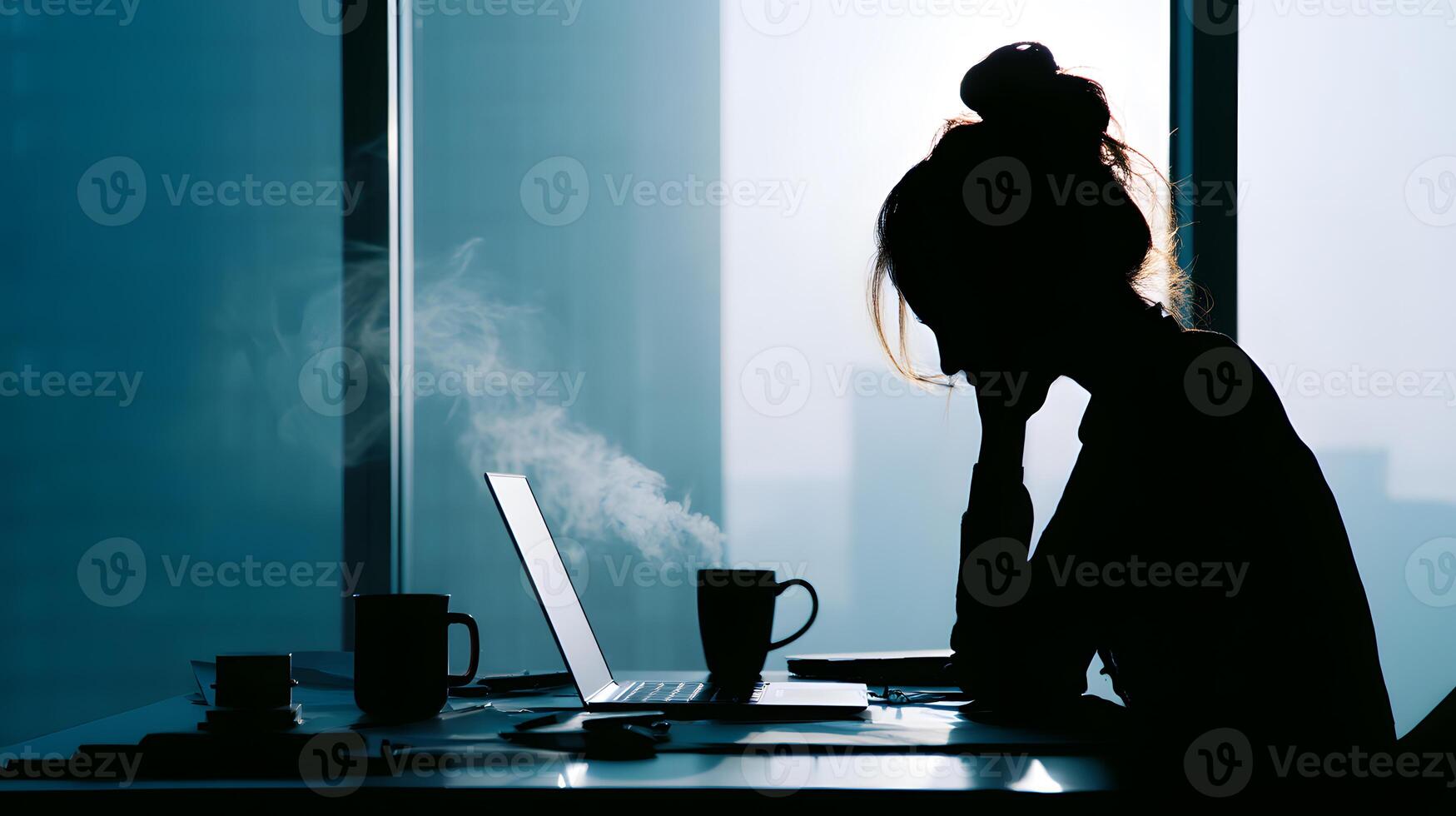 Silhouette of a stressed woman working late at her desk, reflecting the burden of overwhelming responsibilities. photo