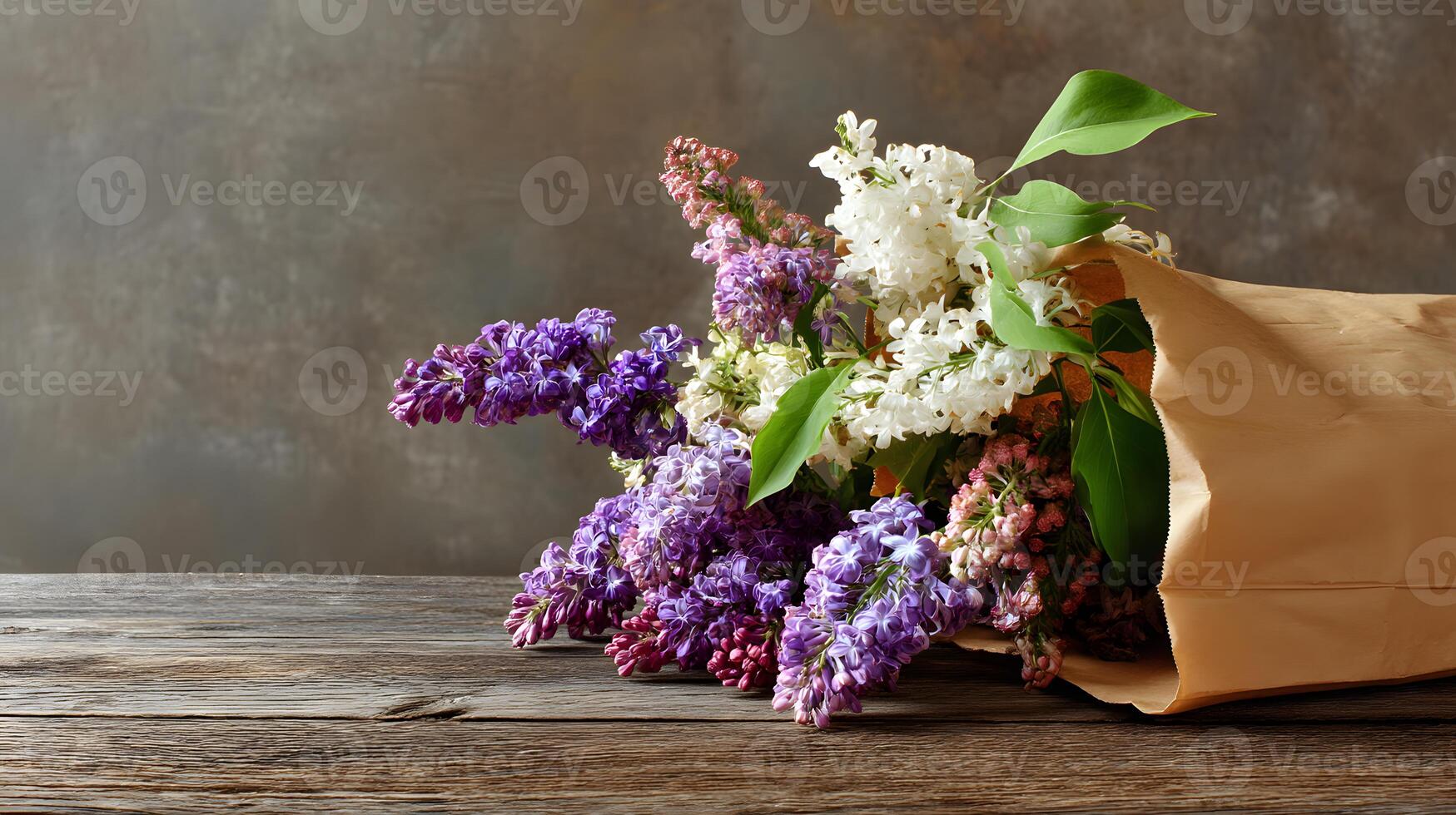 Sweet lilac blooms nestled in a brown paper bag on a weathered wooden surface, complete with a large area for text. photo