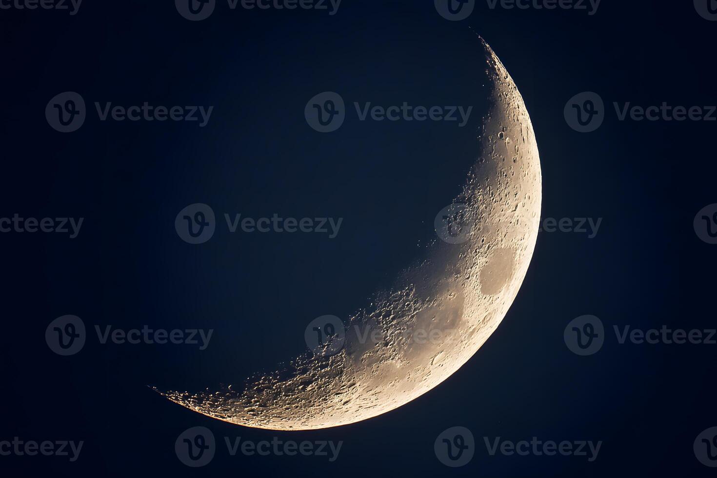 Delicate crescent moon glowing softly in the twilight sky, surrounded by shimmering stars. photo