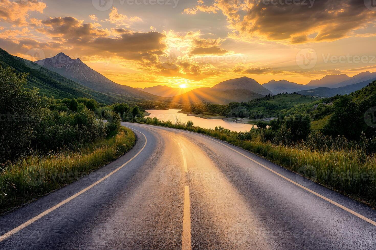 Long empty road leads away towards a dazzling colorful sunset over the open countryside photo