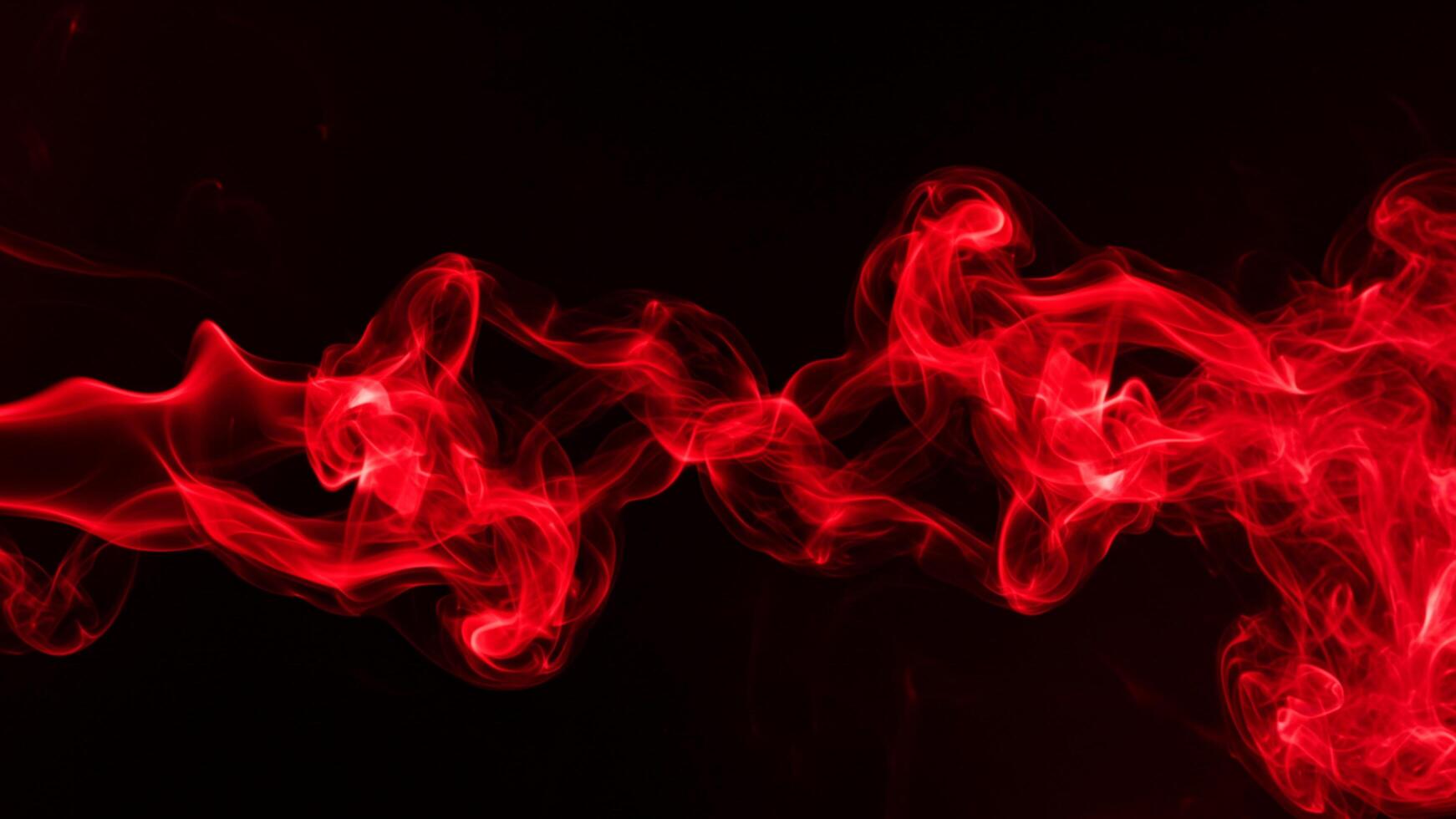 Abstract red smoke on black background, ideal for dramatic visuals photo