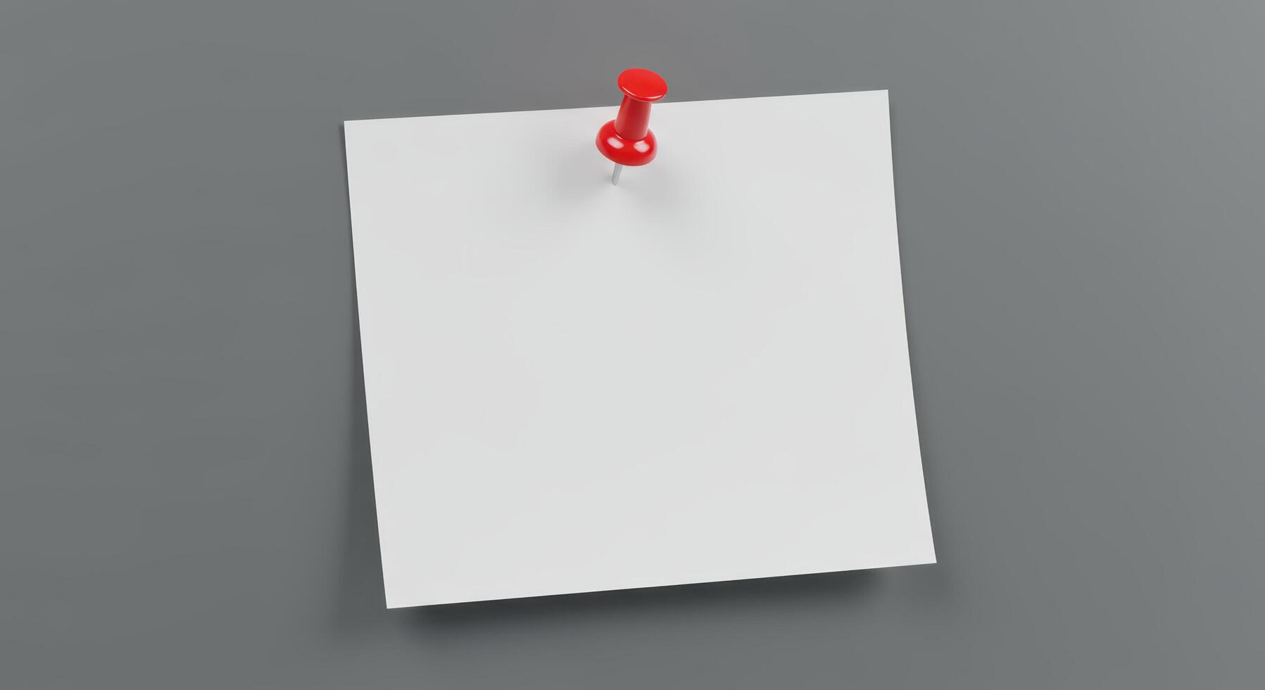 Blank white paper note pinned to gray wall, suitable for advertisements, announcements, reminders, or as a background for quotes or text overlays photo