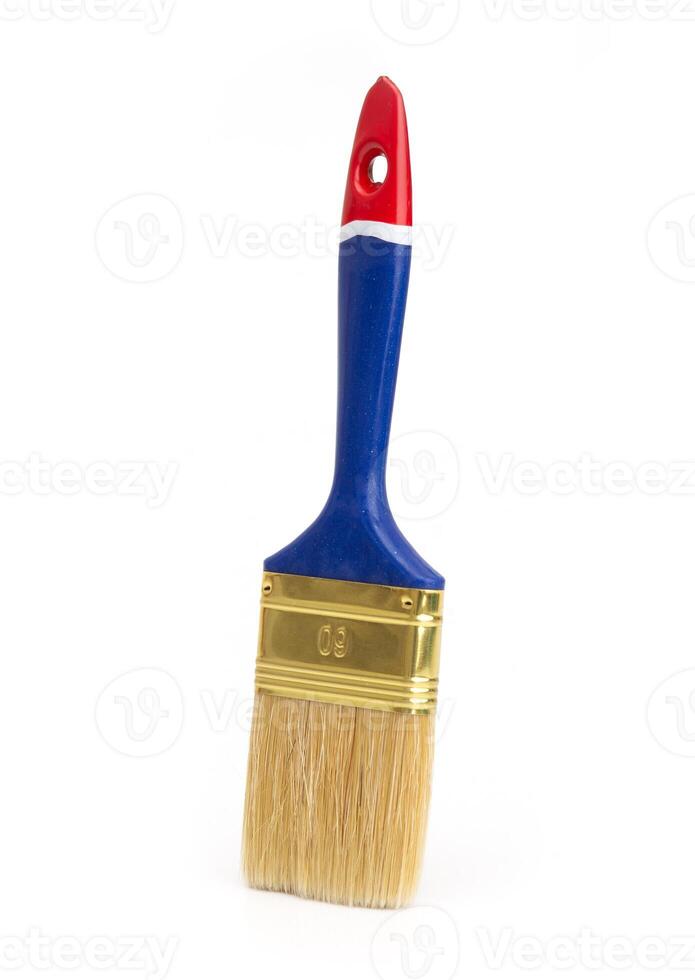 Paintbrush with red, blue handle isolated on white background. Tool for painting and decorating, clean and unused. photo