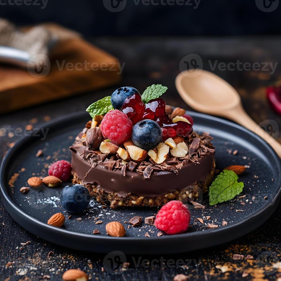 Chocolate mousse cake with berries and nuts on a dark background, selective focus. photo