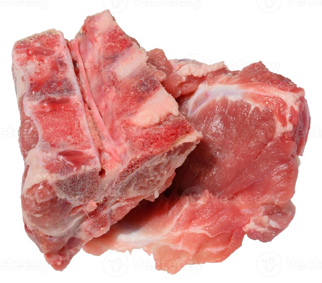 A cut section of raw pork bones with some attached meat and fat, isolated background. photo