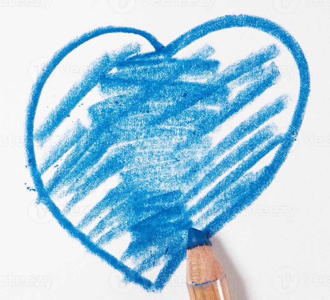 Heart drawn with blue pencil on white paper, close up photo