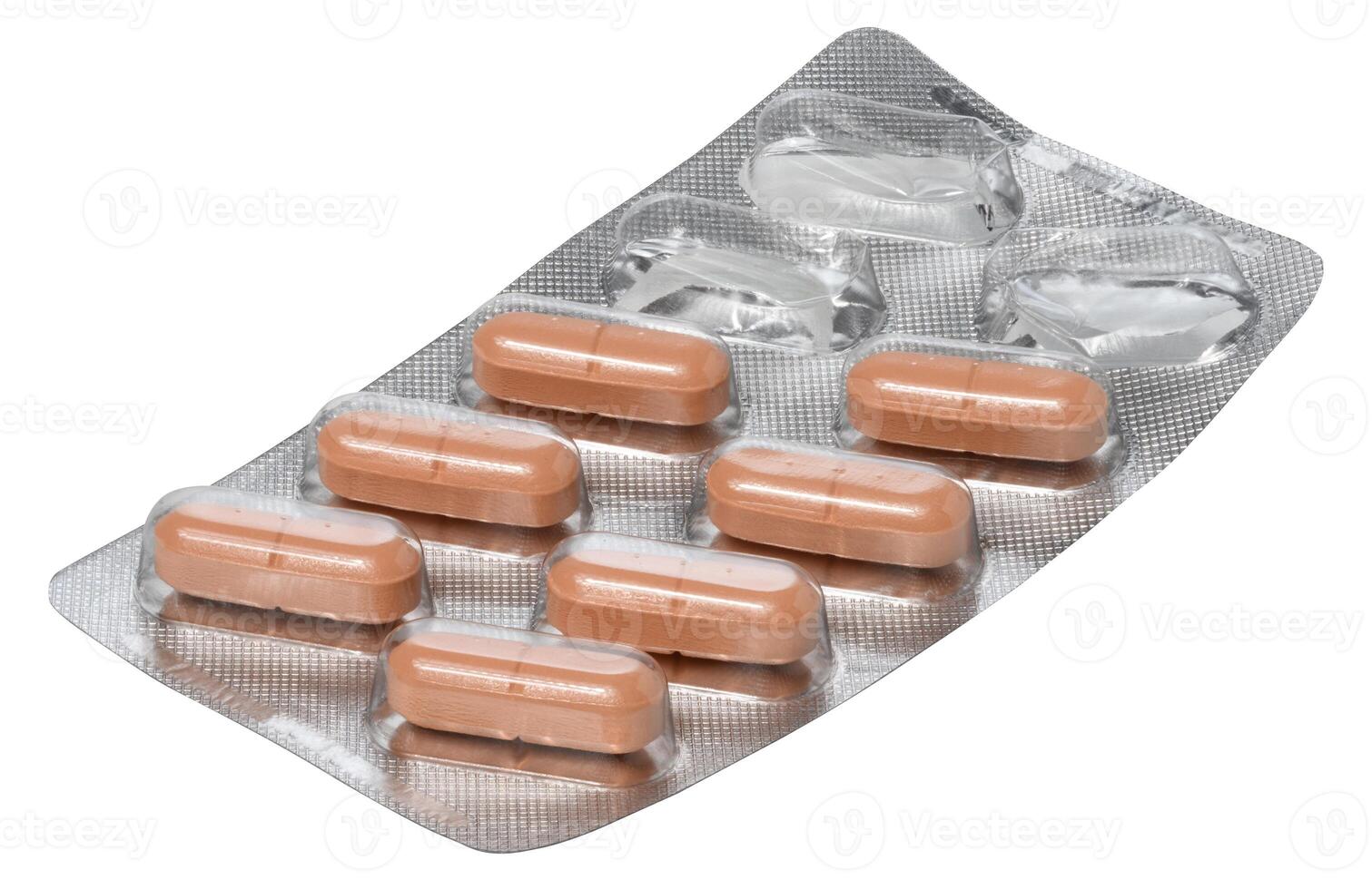 Silver blister pack containing orange oblong pills. Two compartments in the upper right corner of the pack are empty photo
