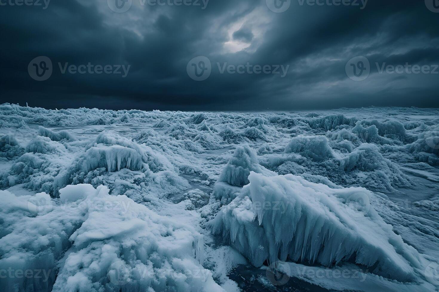 Icy terrain filled with towering ice cliffs under a dramatic cloudy sky, creating a cold and eerie atmosphere. photo
