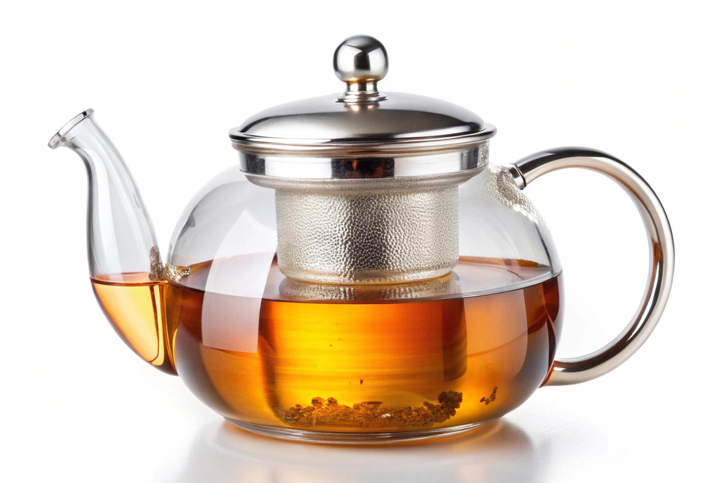 Glass teapot with metal accents, filled with amber tea, capturing the process of brewing tea and its elegant design for a stylish kitchen setup photo