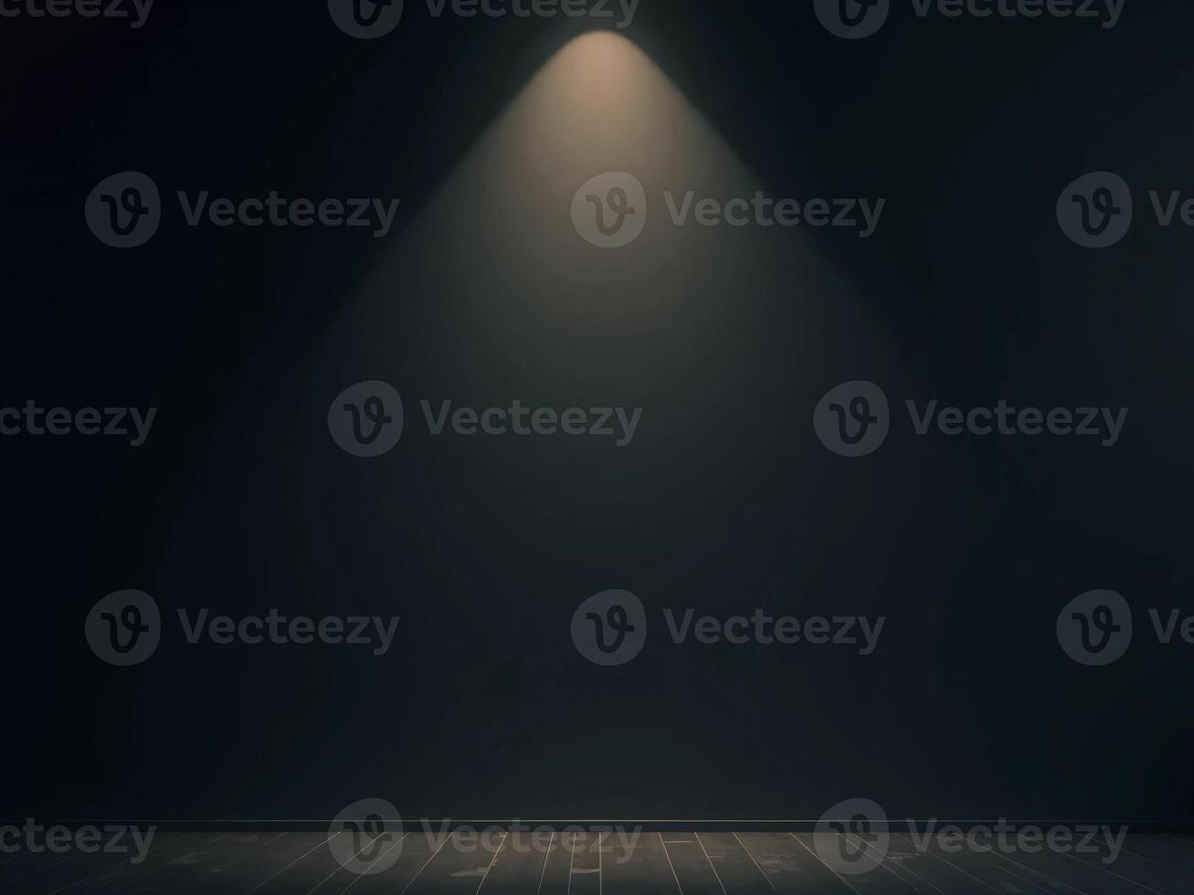 Empty room with dark floor and light coming from the ceiling photo