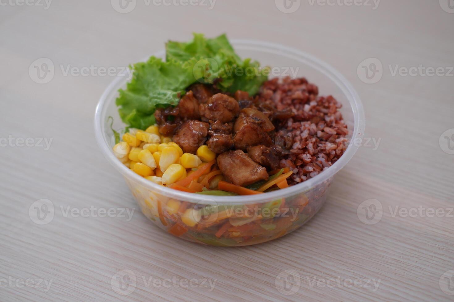 a nutritious meal served in a transparent plastic bowl, ideal for takeaway photo