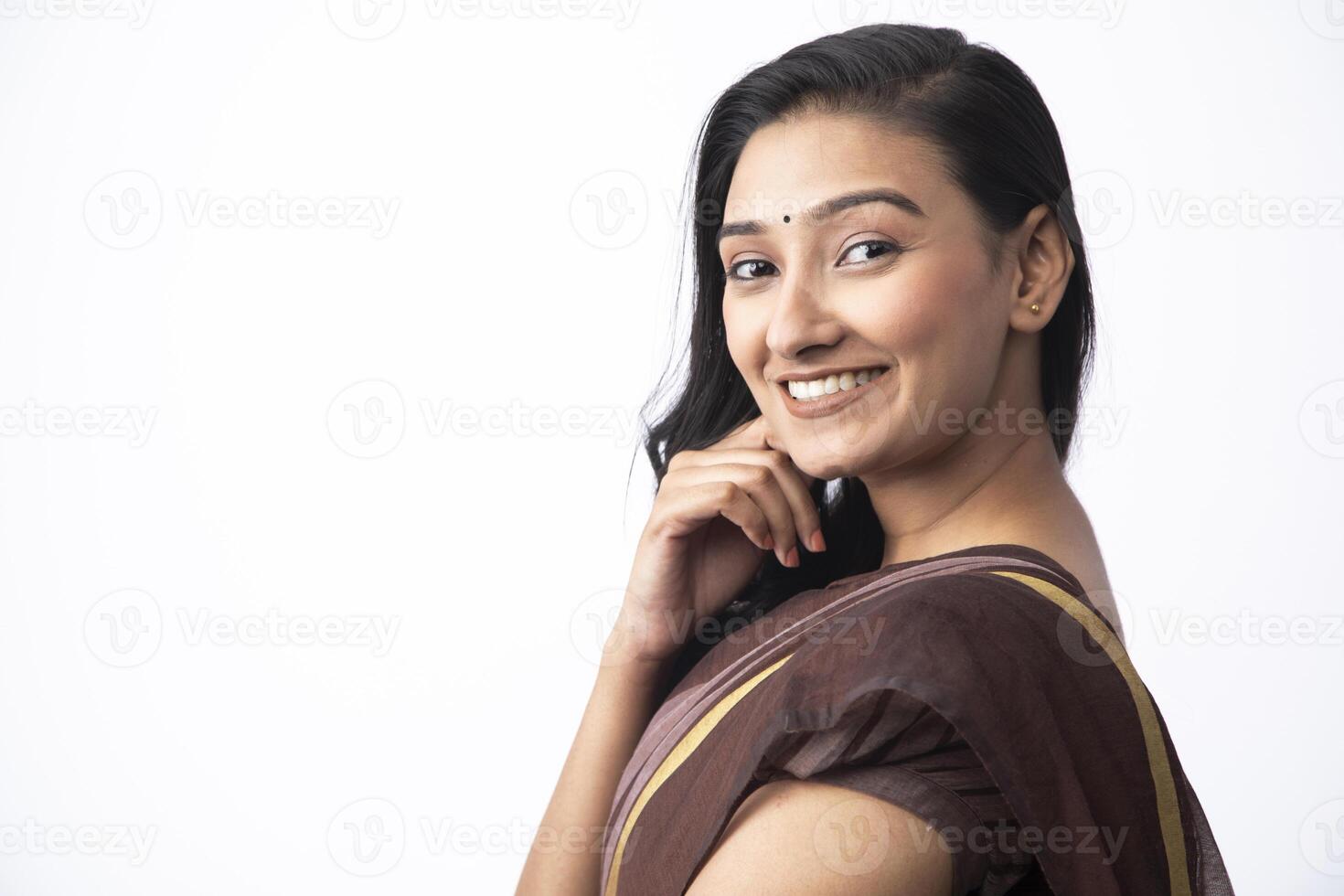 Pretty Young Model Smiling While Looking At Camera photo