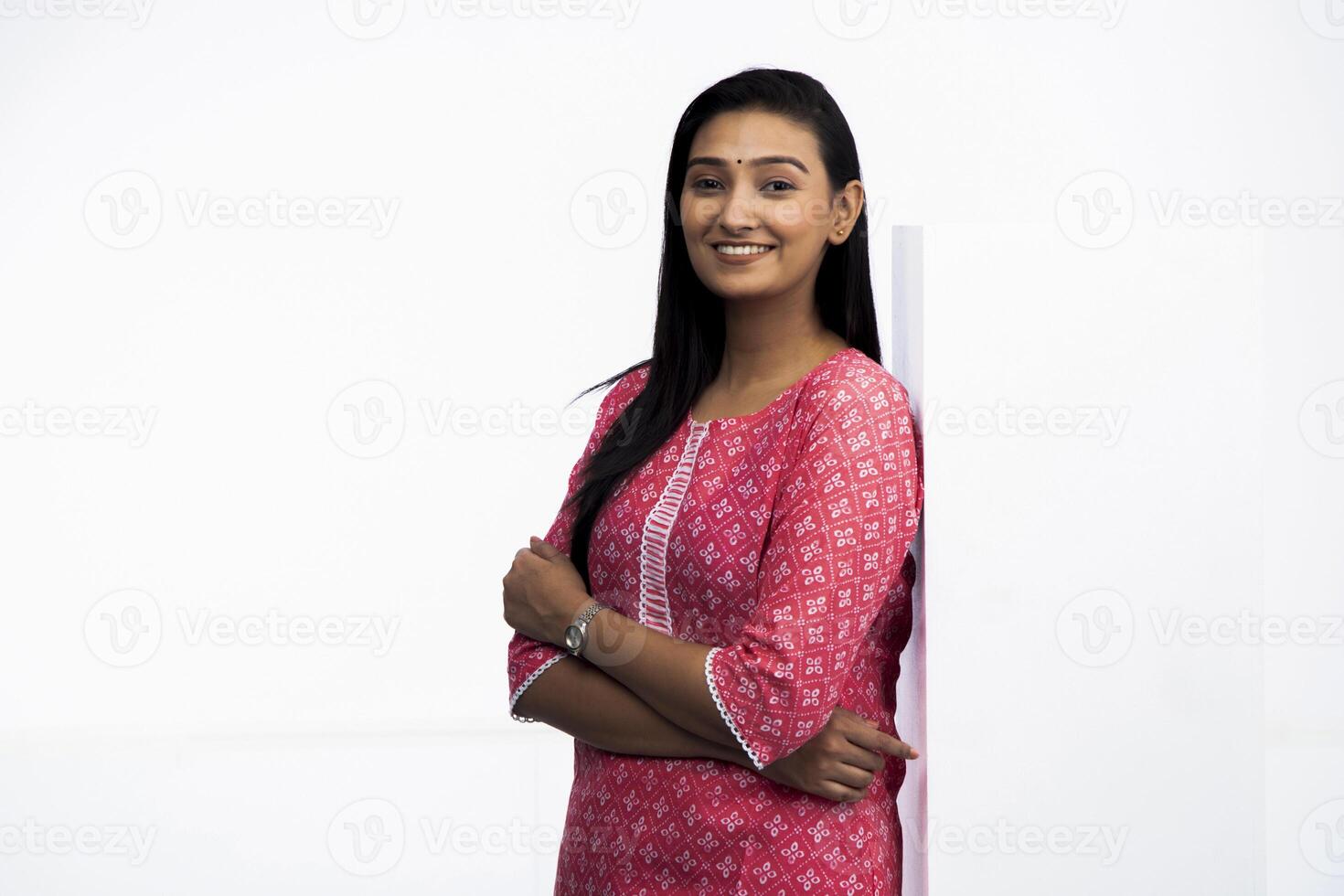 Beautiful Adult Woman With White Blank Board Looking At Camera photo