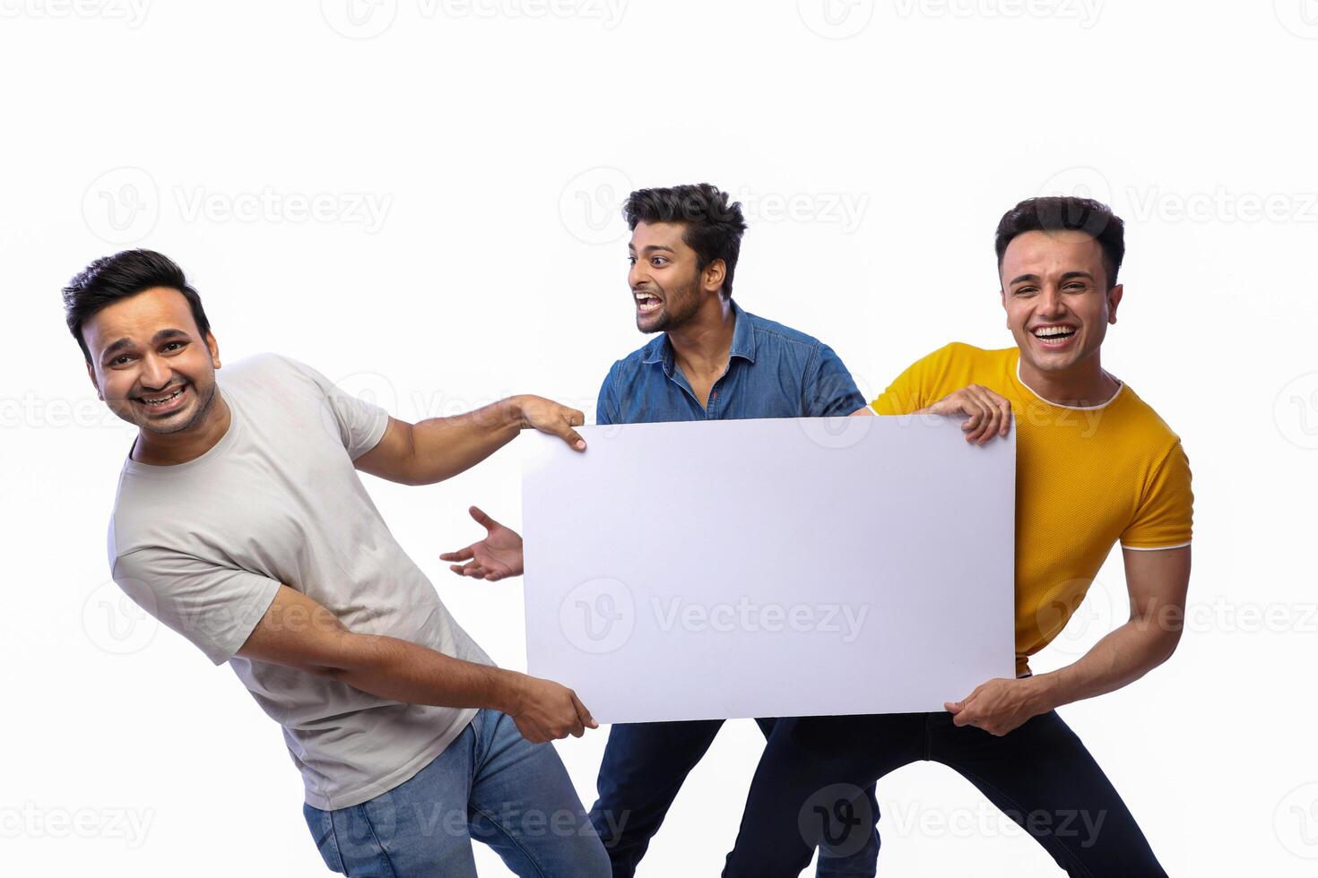 Three young models are holding a blank banner. photo