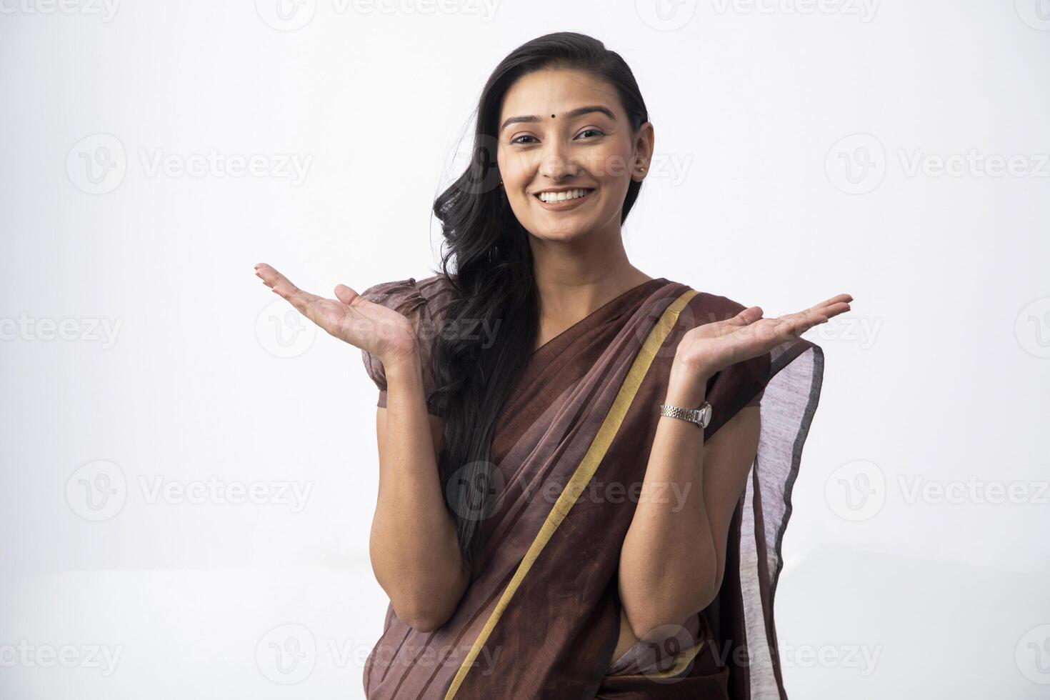Stylish Model In Saree Showing Both Hands Open Palms While Looking At Camera photo