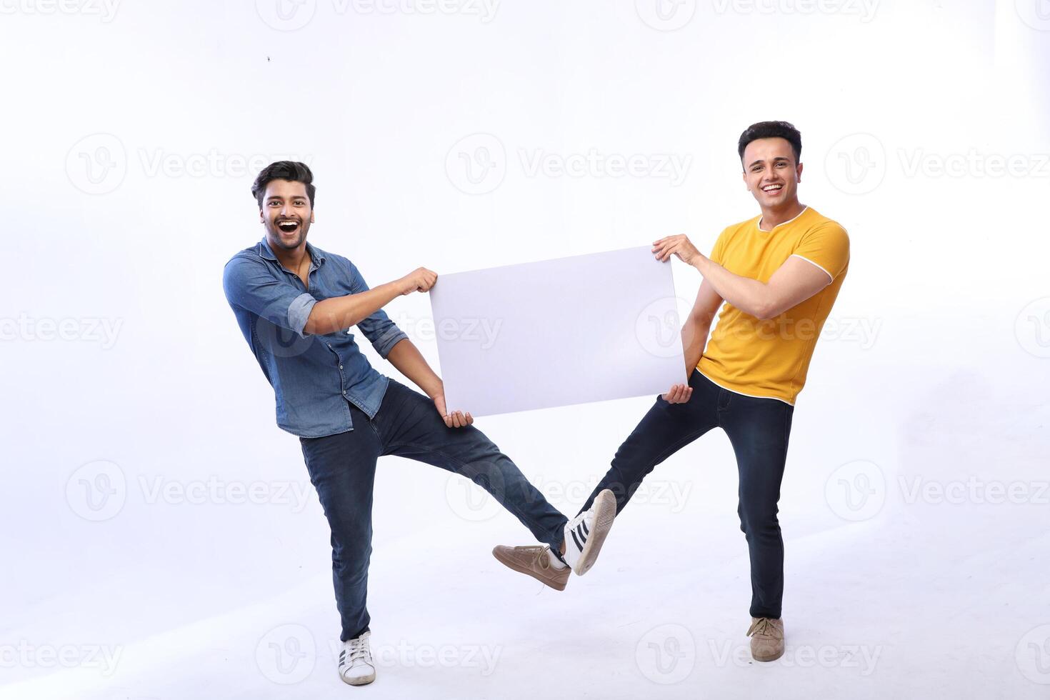 Smiling Asian male models are holding a white blank banner photo