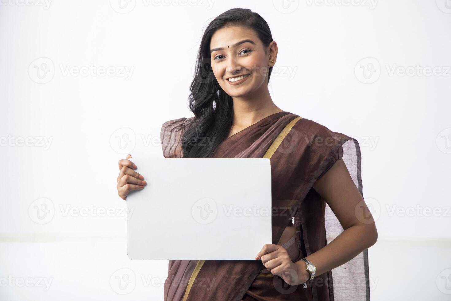 Model Posing With Whiteboard In Front Of Camera photo