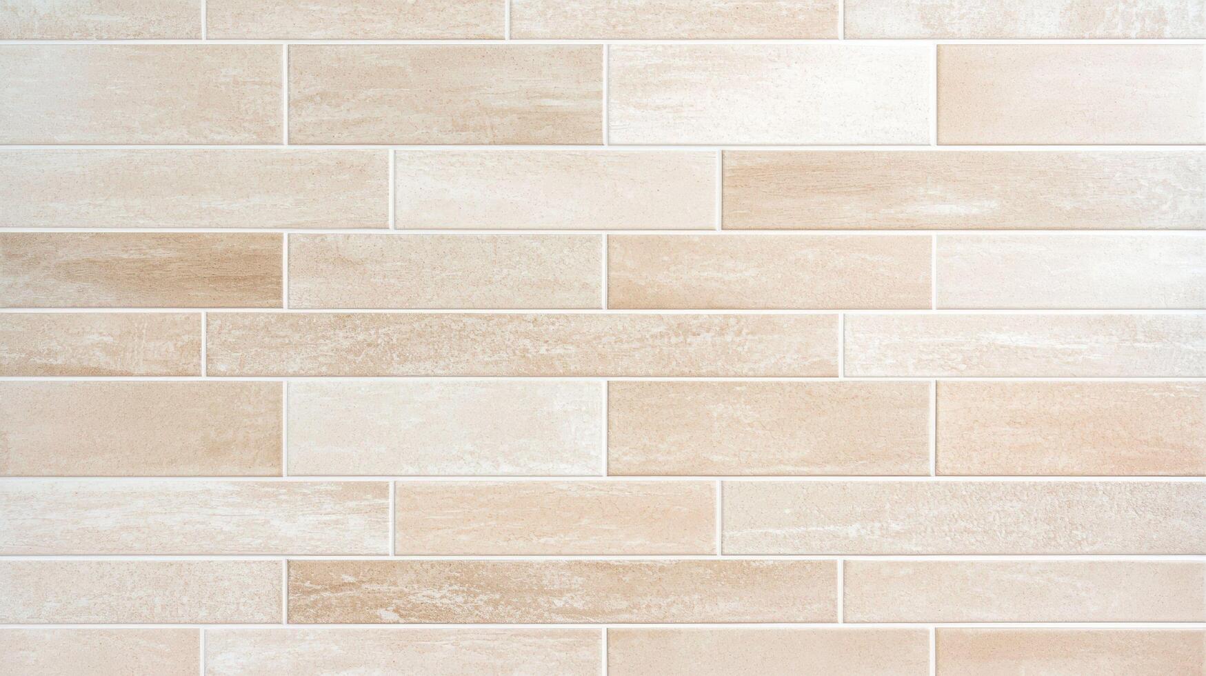 Beige Ceramic Wall Tile Pattern Background featuring rectangular tiles arranged in a clean horizontal layout with a textured surface and warm neutral tones. photo