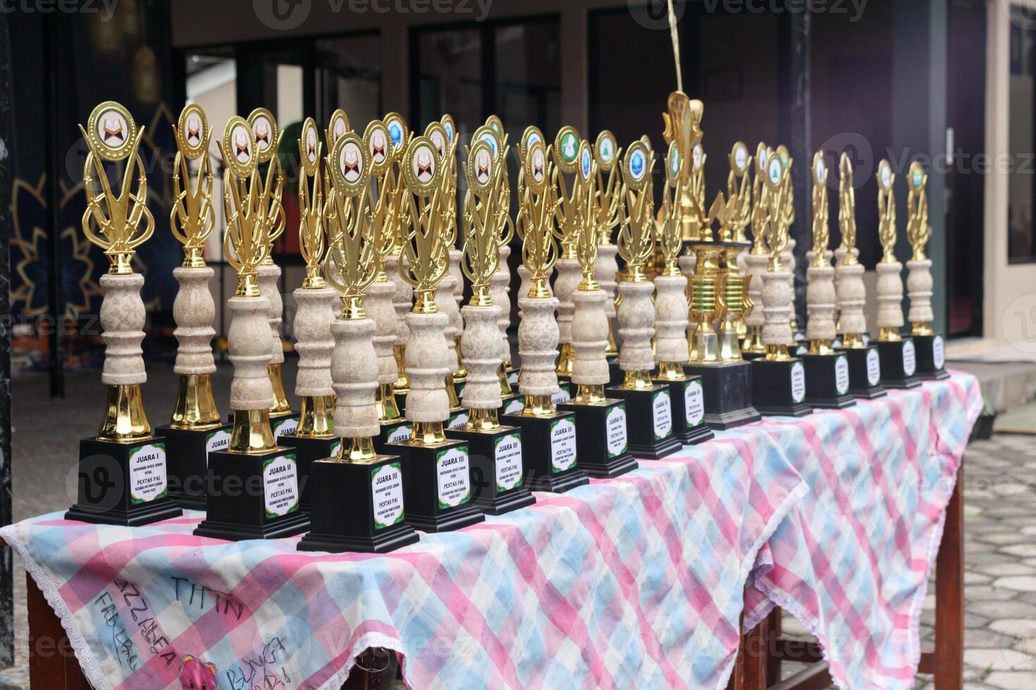 Golden Trophy lineup for school competition winners highlighting academic and talent success in award ceremony event photo