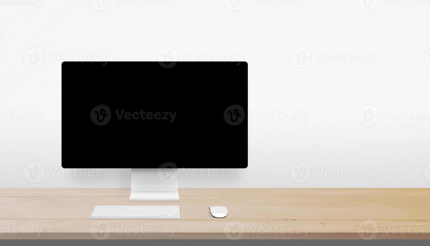 Minimalist desktop setup with wooden surface, blank monitor, and wide open space on the right for branding, advertising, or creative messaging photo