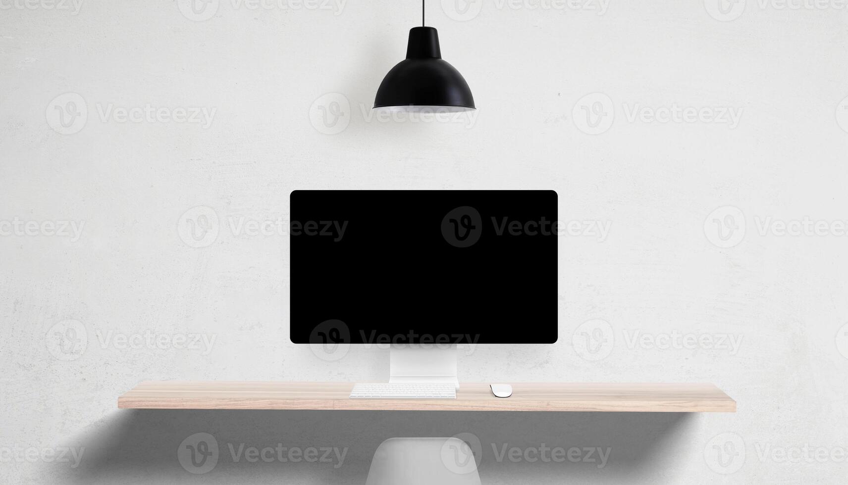 Desktop computer with blank screen on clean desk, overhead lamp and empty side space, perfect for UI mockups and marketing copy placement photo