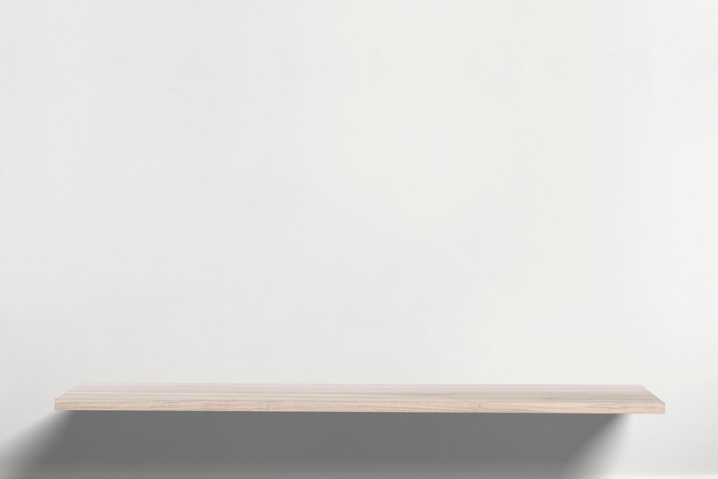 Sleek wall-mounted wooden desk with warm hues, blending into a neutral background, perfect for contemporary home office and space-saving furniture solutions photo