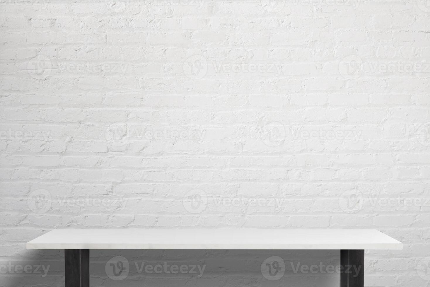 Minimalist workspace featuring a sleek white table with black legs, bright lighting, and a white brick background, perfect for office branding and creative work environments photo