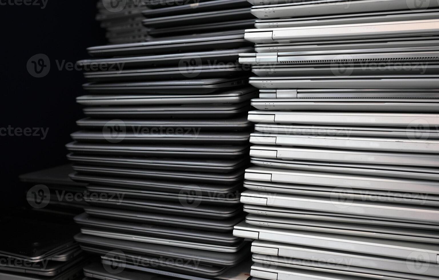 E-waste - big stacks of obsoletlaptops to be discardede photo
