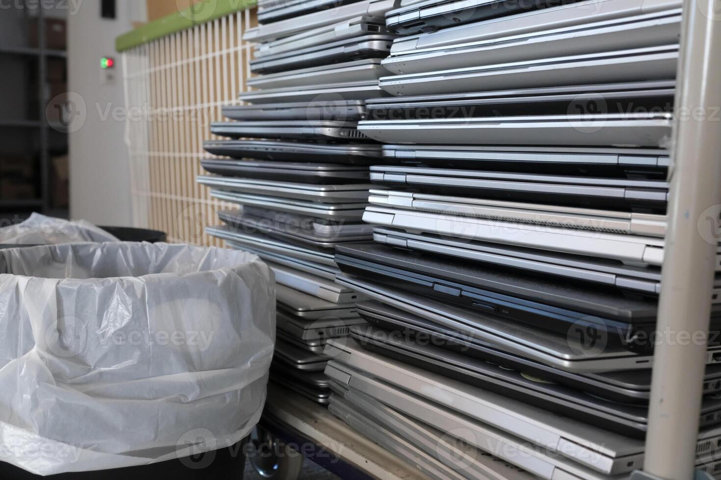 E-waste - stacked laptops to be discarded photo