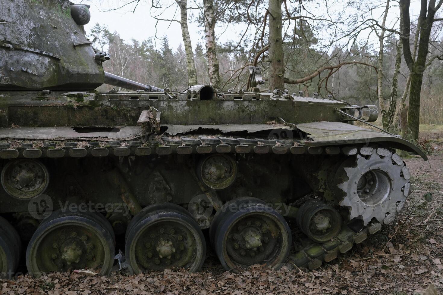 Remains of a tank from the second World War in a forest in Germany photo