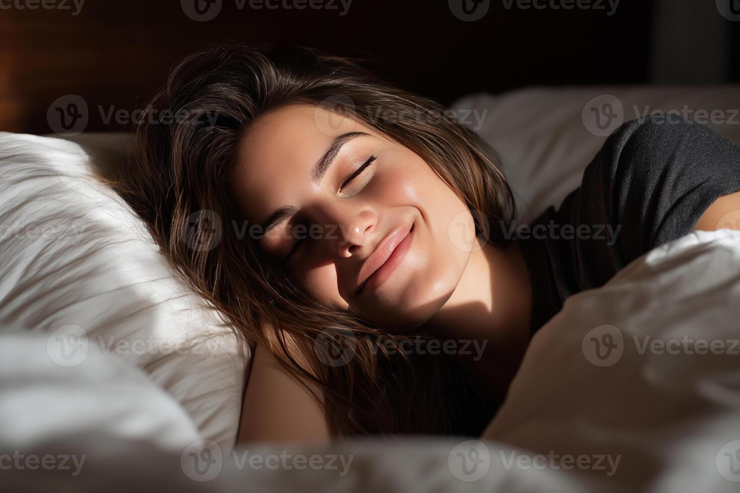 a woman is sleeping in bed with her eyes closed photo