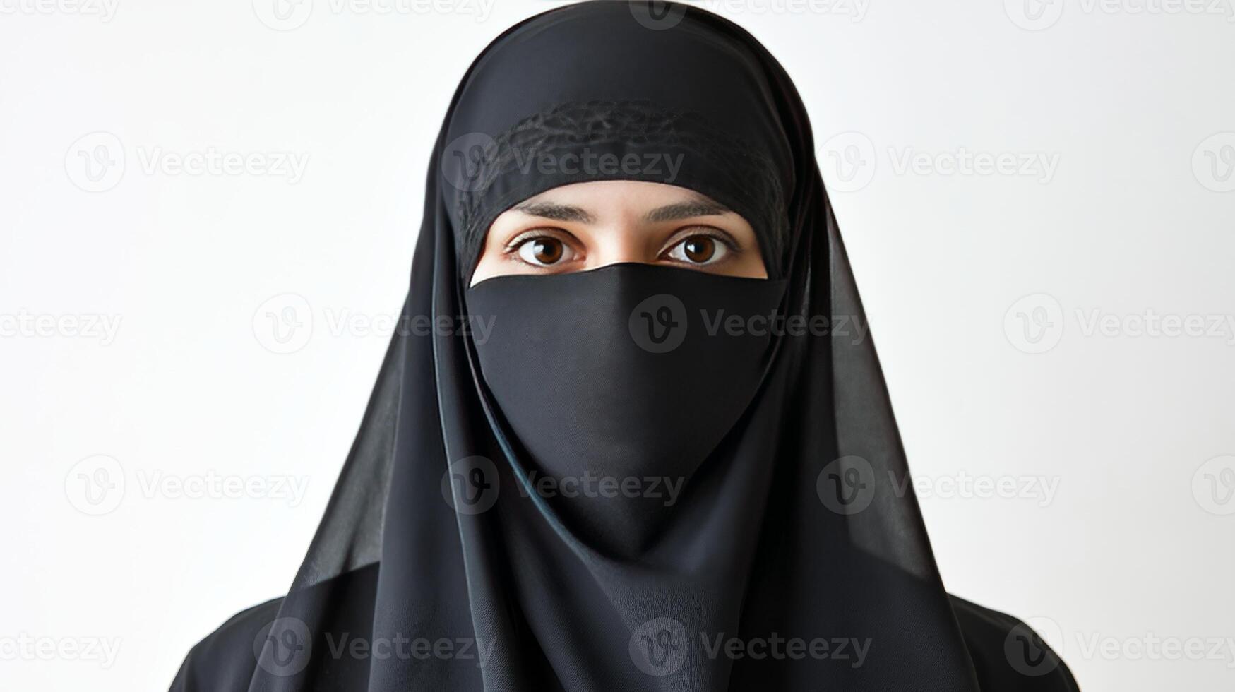 Woman in black attire with intense gaze presenting a powerful statement photo