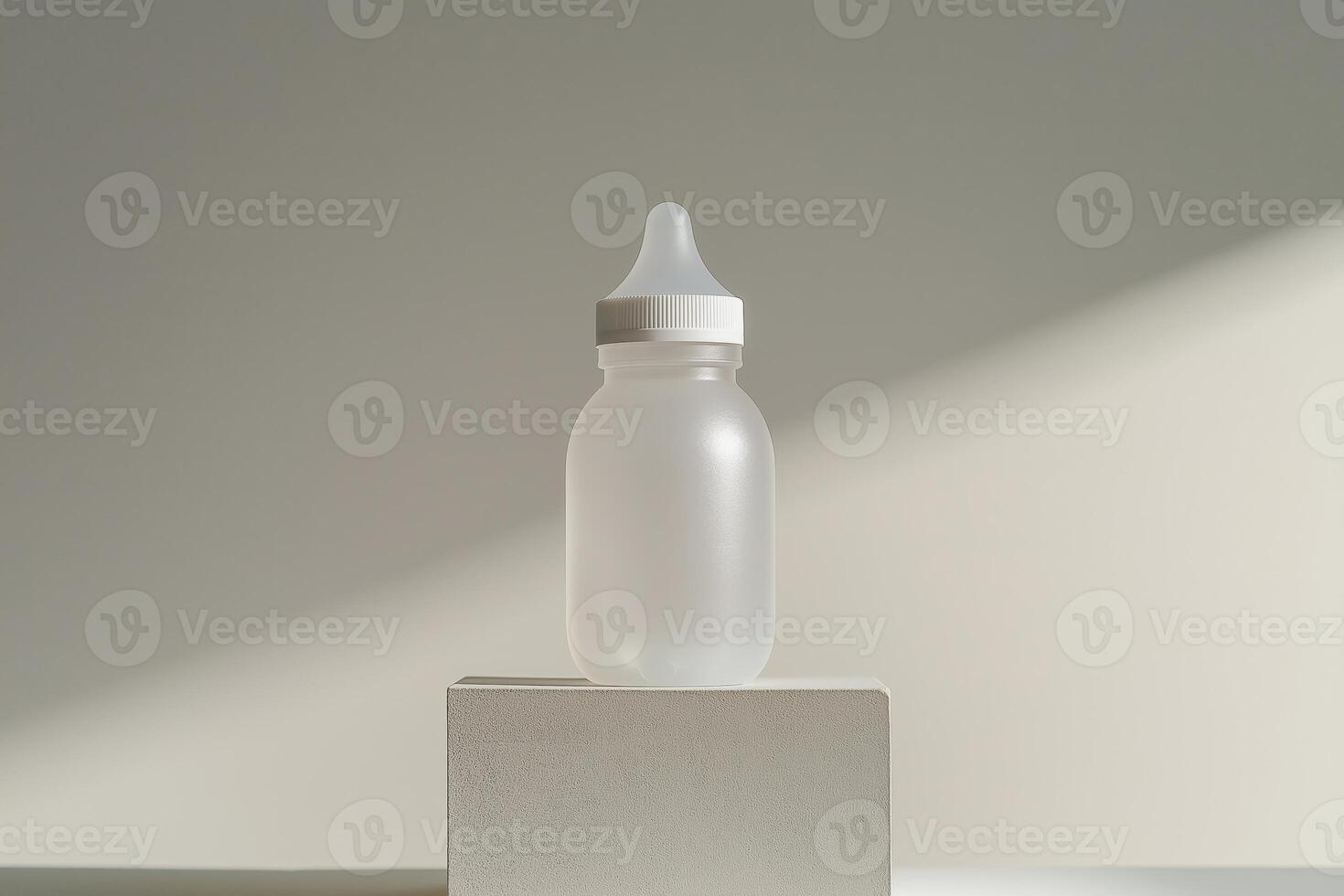 Sleek design of a baby bottle placed on a minimalistic pedestal photo