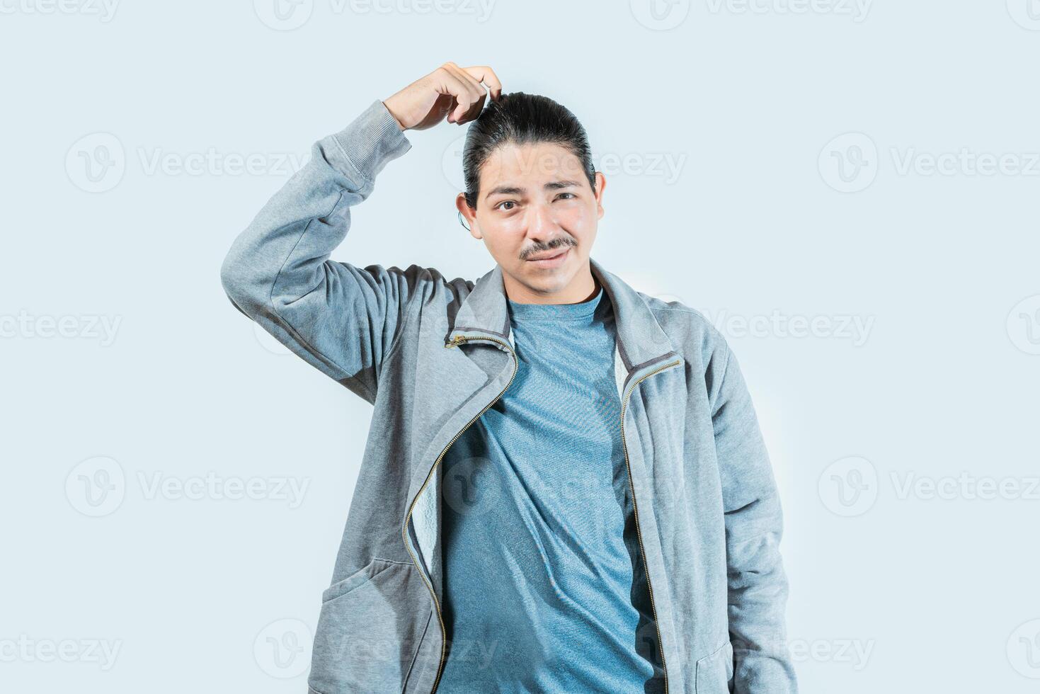 Confused guy scratching head isolated. Worried man scratching head with confused face isolated photo
