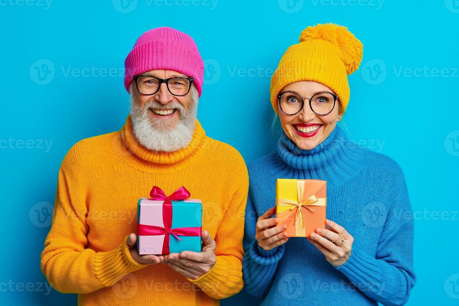 A man and a woman wearing colorful hats and holding presents photo