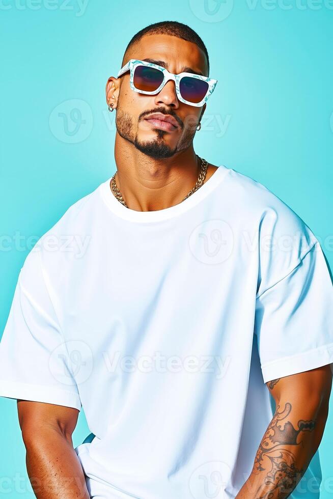 A man wearing a white t-shirt and sunglasses poses for a picture photo