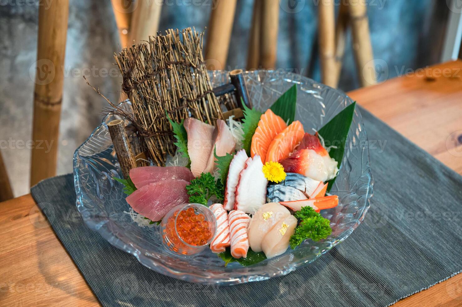 Various japanese fresh sashimi fish and seafood set on table photo