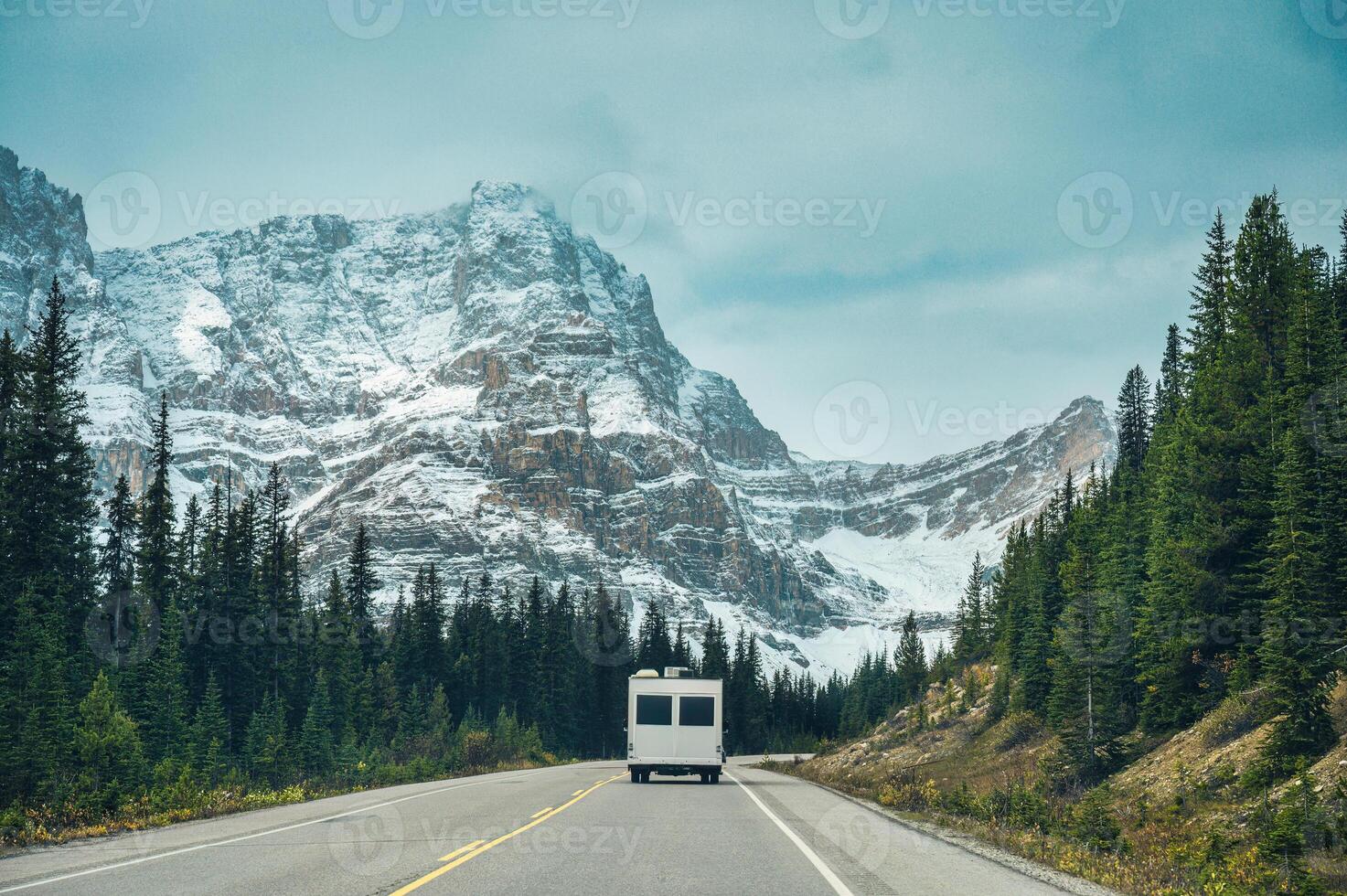 Road trip with motorhome driving in rocky mountains in summer at Banff national park, Canada photo