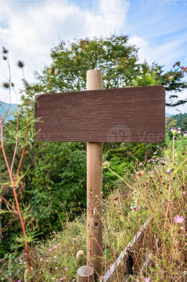 Wooden signboard in the garden photo