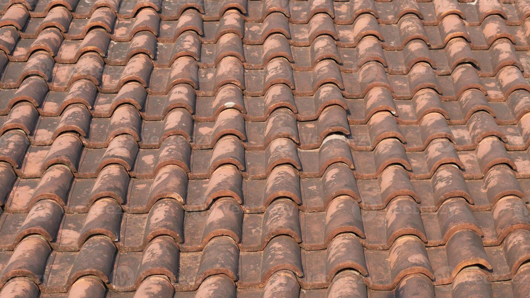 Red terracotta tile roof pattern background texture. photo