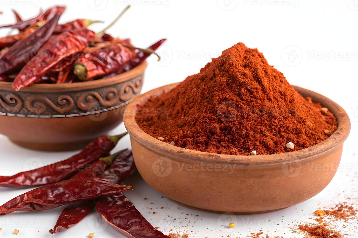A bowl of chili powder and a bowl of chili photo