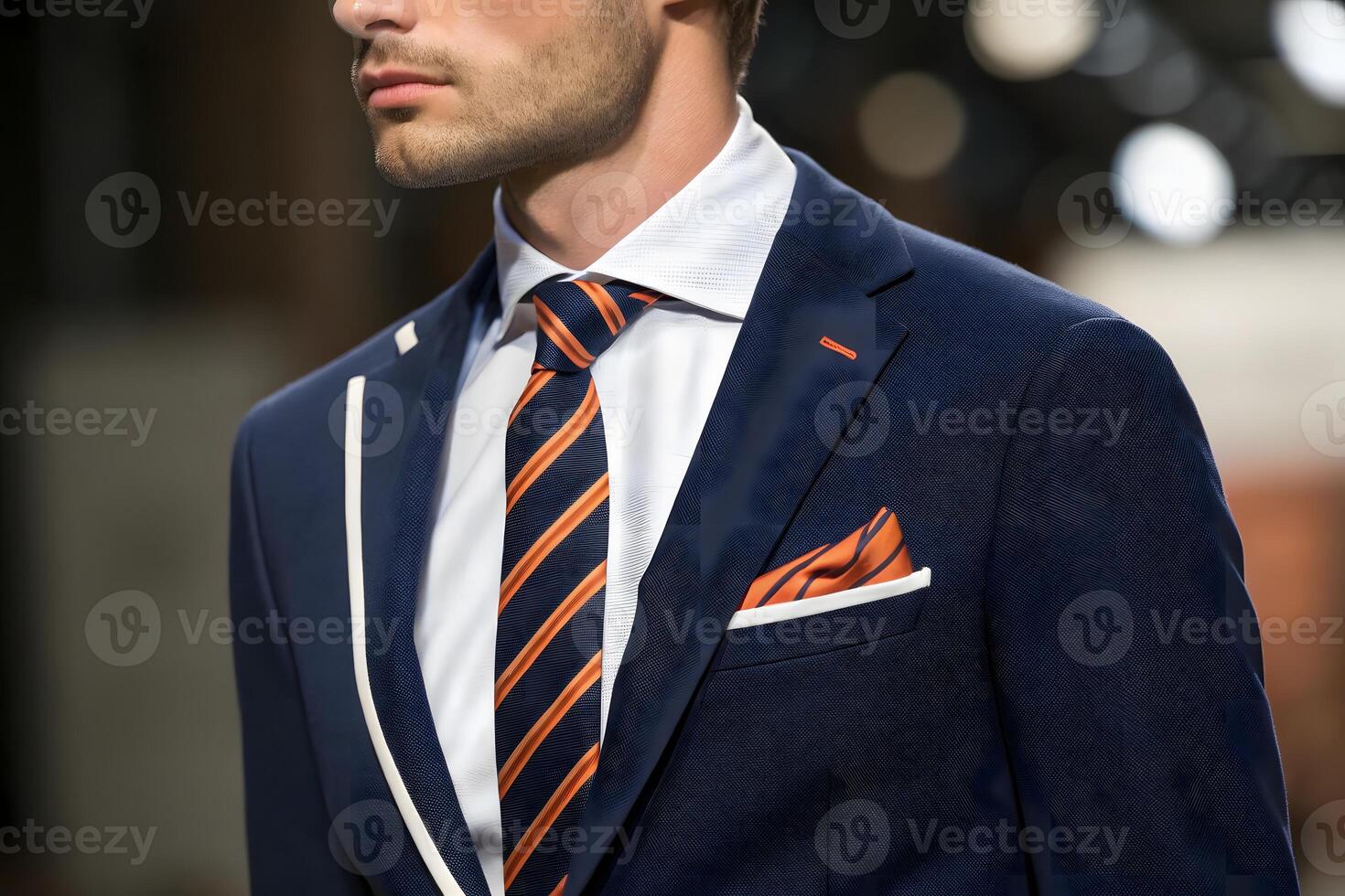 A man in a suit and tie on the runway photo