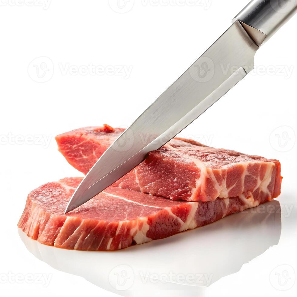 Fresh cuts of meat being sliced with a sharp stainless steel knife photo