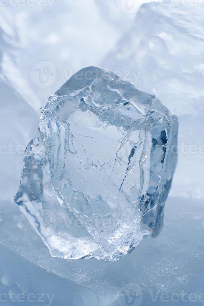 Textured Ice Chunk Resting on a Frozen Surface photo