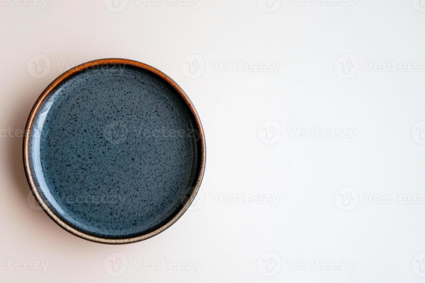 Decorative blue plate on a clean surface with simple design and natural tones photo