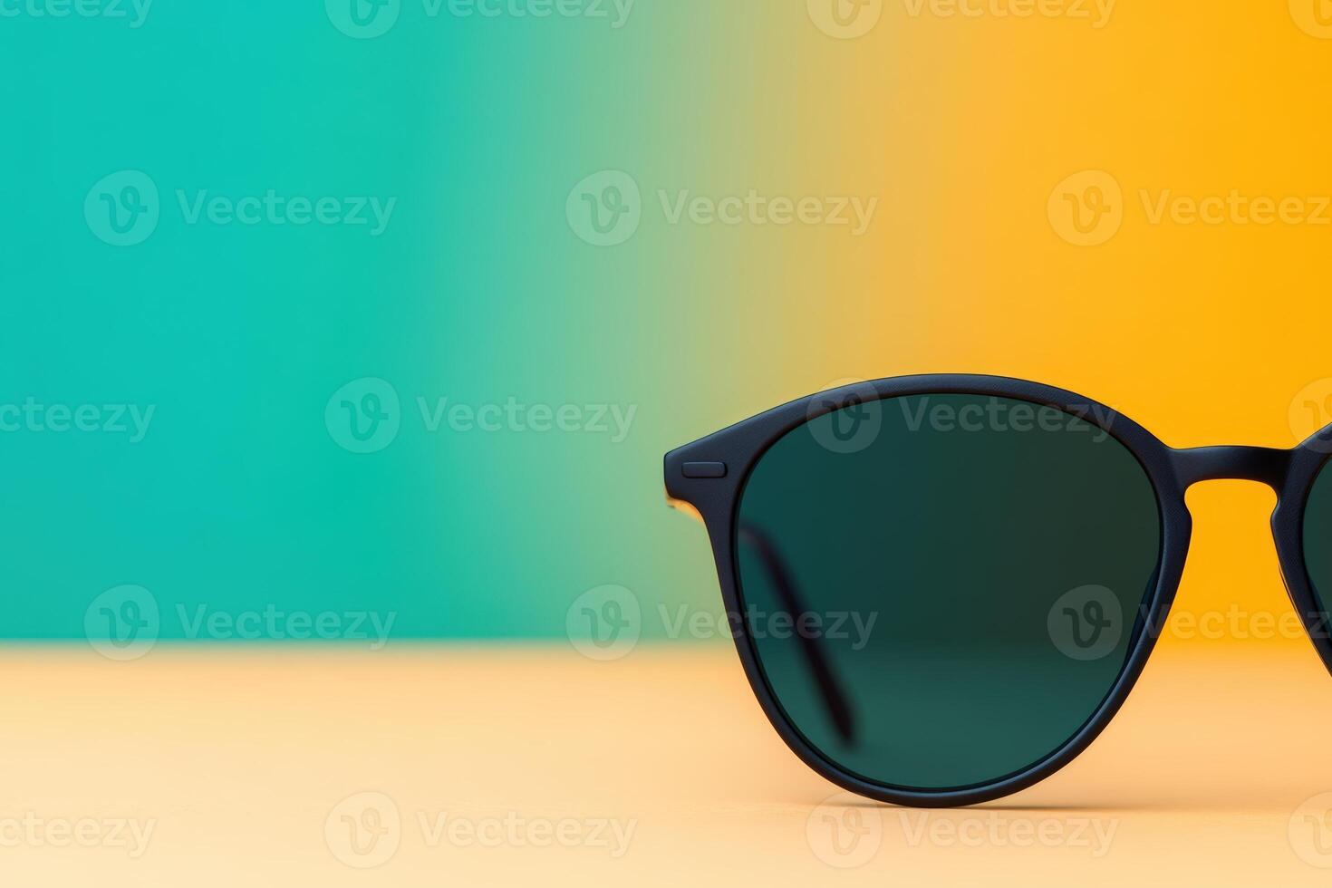 Stylish sunglasses with dark lenses against a colorful background in bright daylight photo