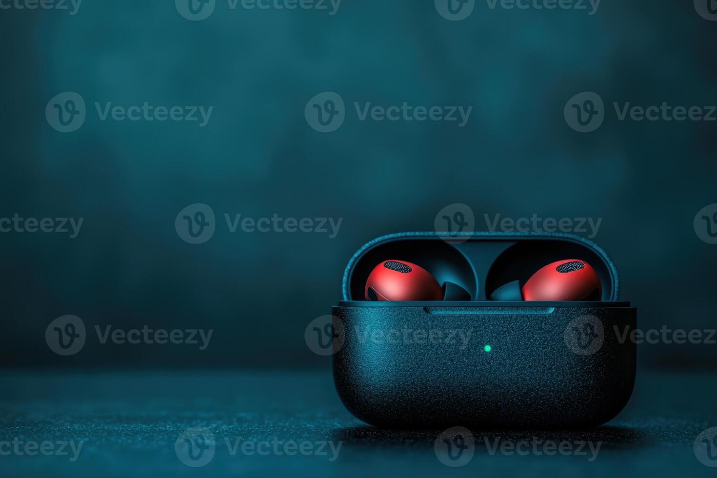 Wireless earbuds charging in a sleek black case with a blue background photo