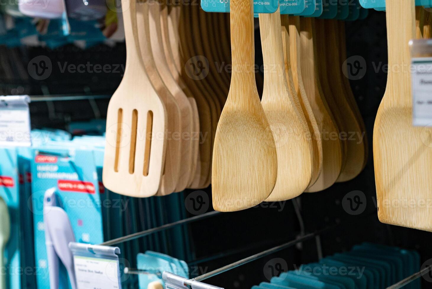 Various kitchen utensils made of wood in the stand. Copy the place for the close-up text. Environmental friendliness. Reuse. Handmade work. photo